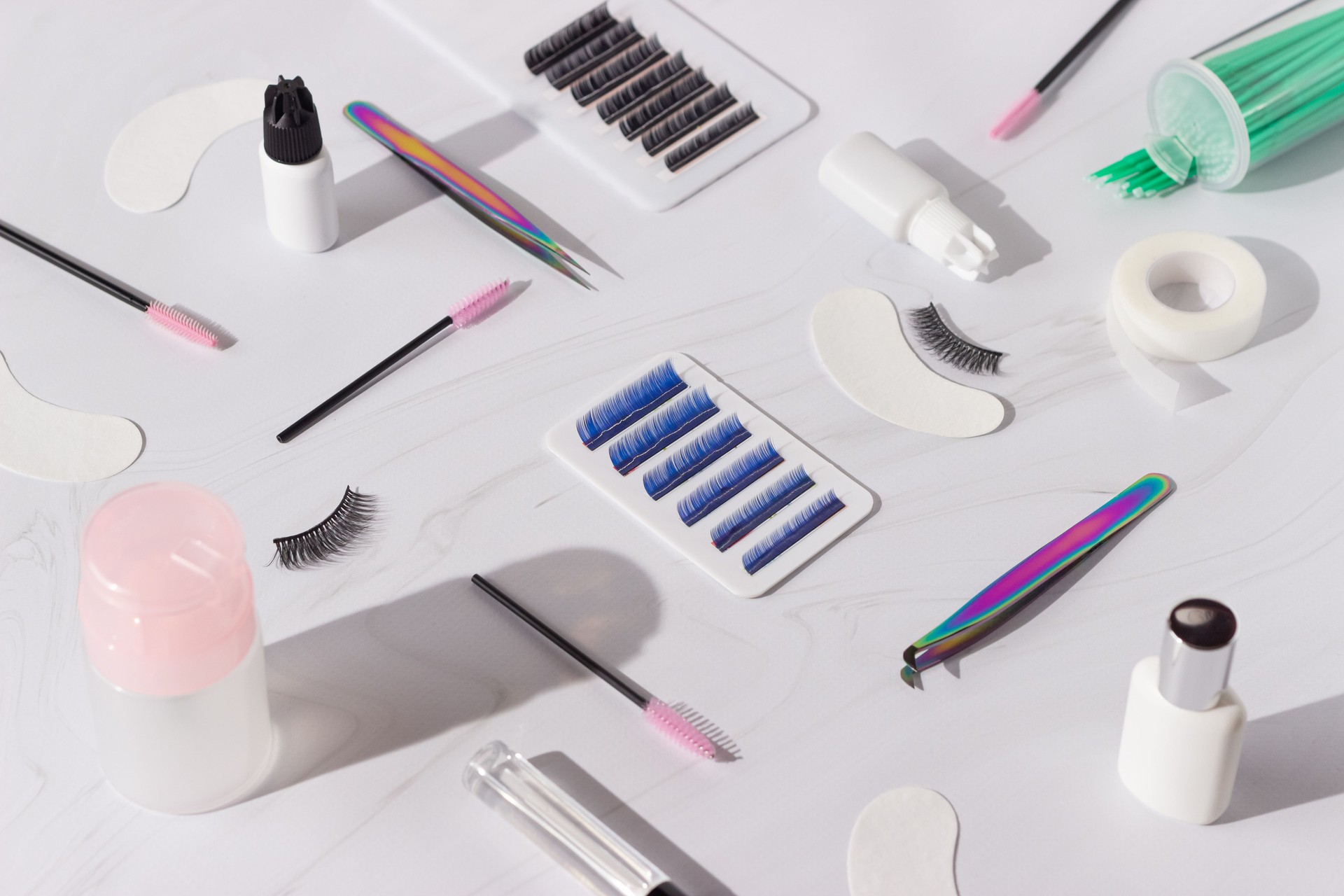 Things for the work of lash-makers, artificial eyelashes, microbrachis, glue, tweezers, combs, brushes for eyelash extensions. Eyelash extension, painting of eyebrows.